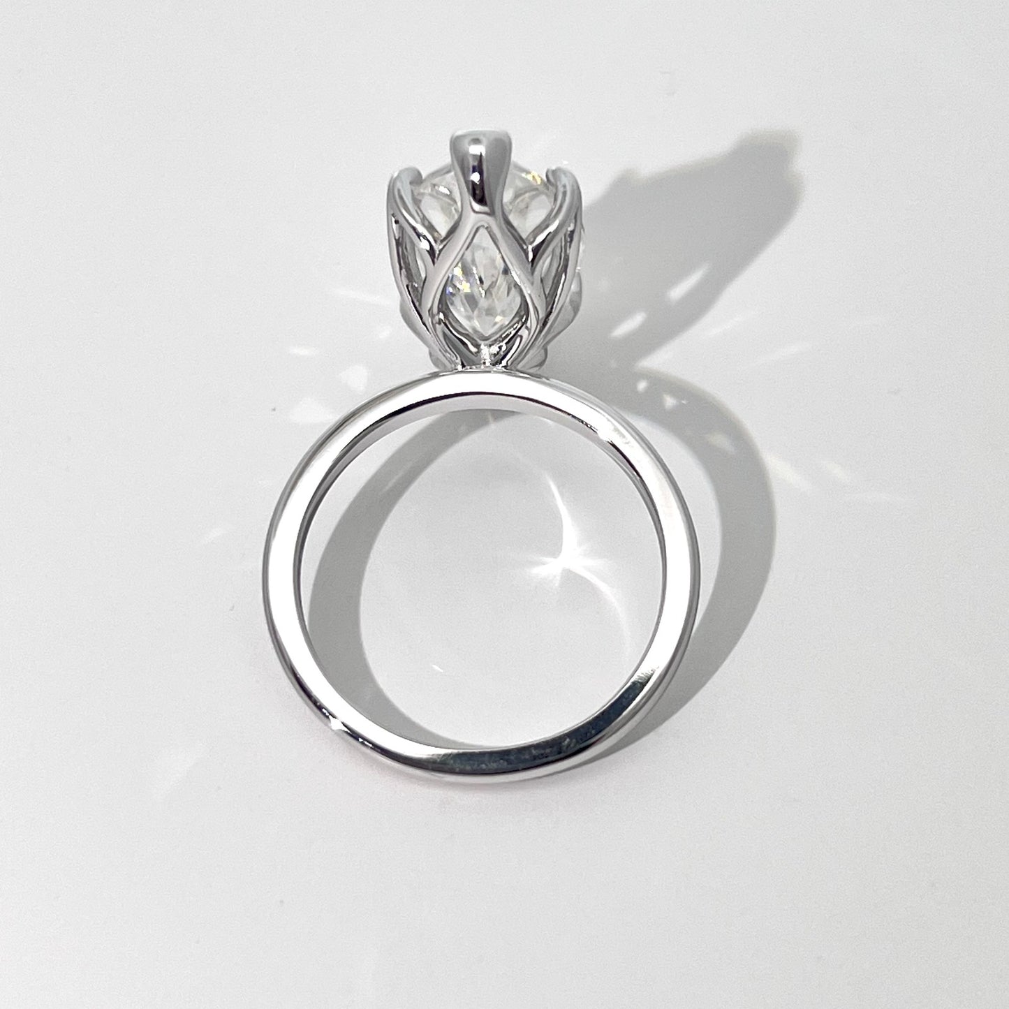 Vespera moissanite ring showing the open basket setting from the back