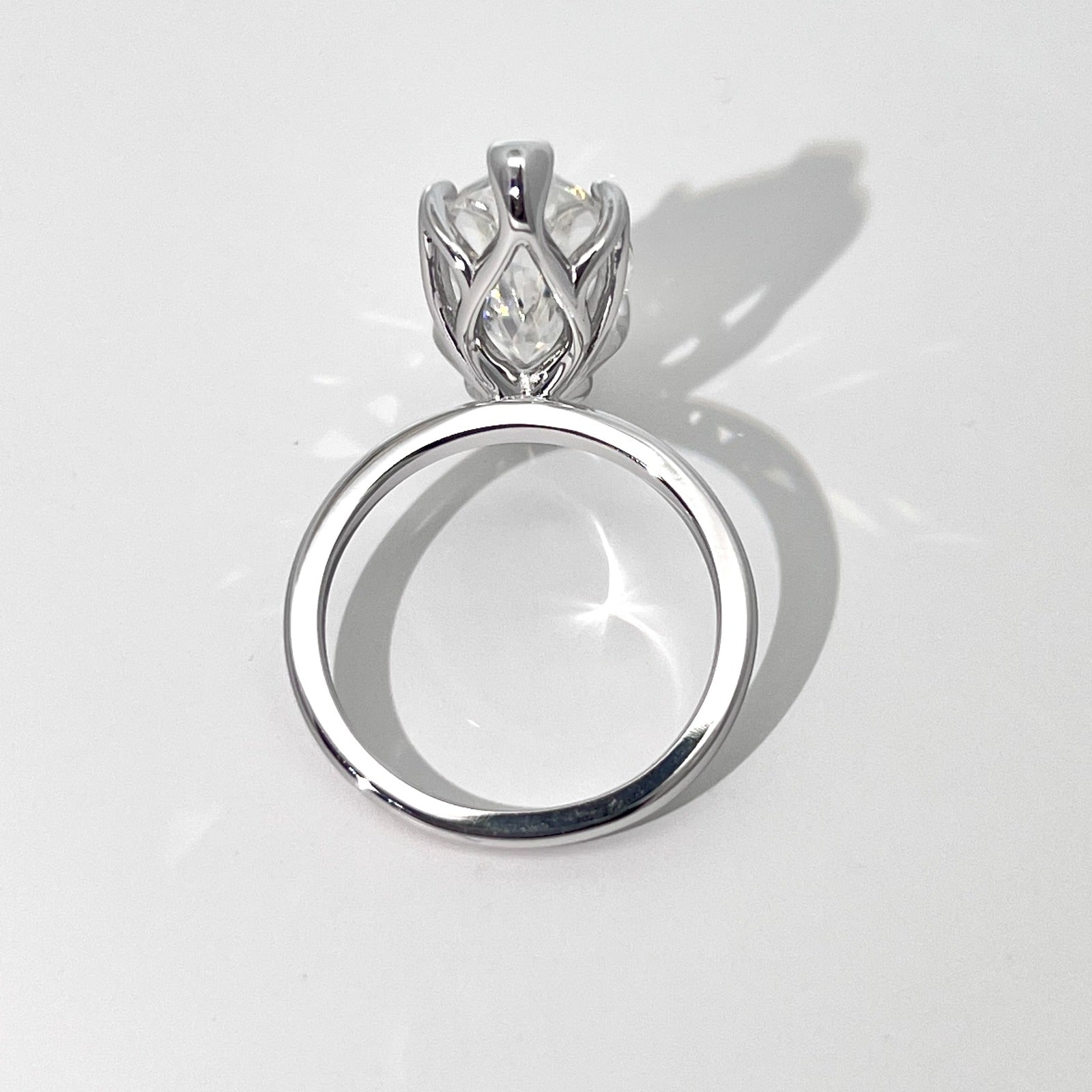 Vespera moissanite ring showing the open basket setting from the back